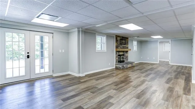 a view of balcony with wooden floor and outdoor seating