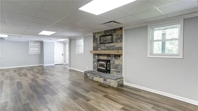 a view of balcony with wooden floor and fence
