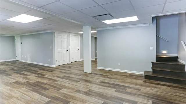 a view of balcony with wooden floor and outdoor seating