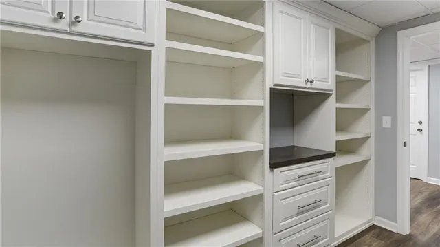 a kitchen with a sink a stove and cabinets