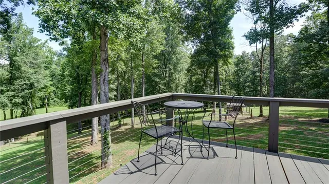 a view of a park with trees in the background