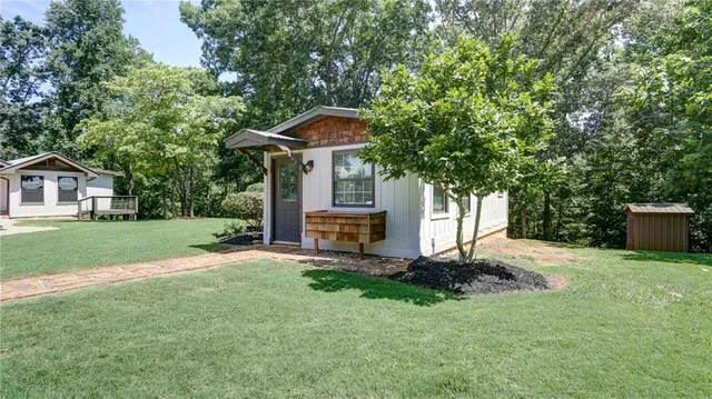 an aerial view of a house with a swimming pool