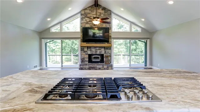 a view of a livingroom with a fireplace and a flat screen tv