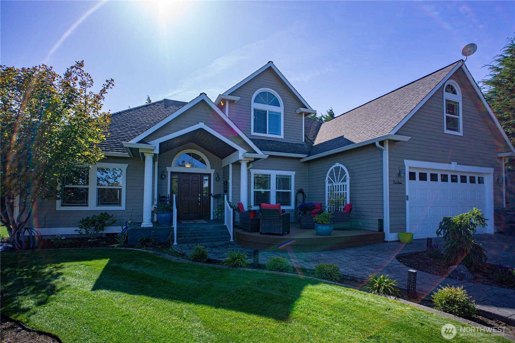 a front view of a house with garden
