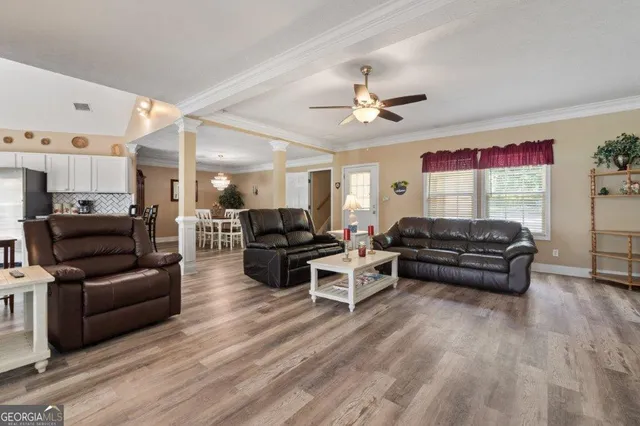 a kitchen with stainless steel appliances granite countertop a stove and a refrigerator