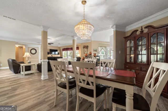a view of a dining room with furniture window and outside view