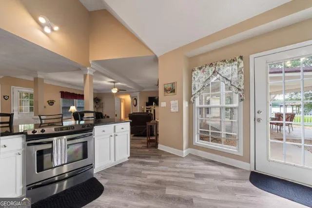 a bedroom with a large bed and a window