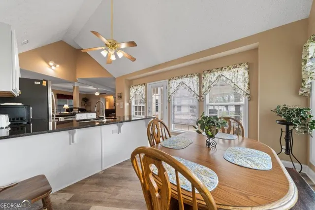 a bathroom with a toilet a sink and a mirror