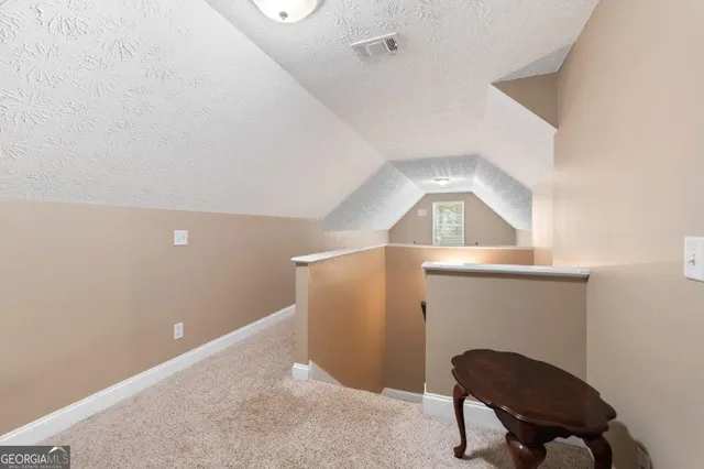 a view of a park with large trees