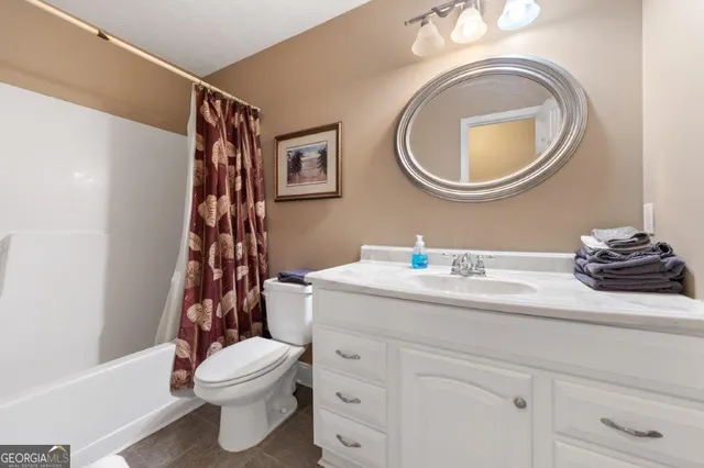 a view of a chairs and table in patio with wooden floor