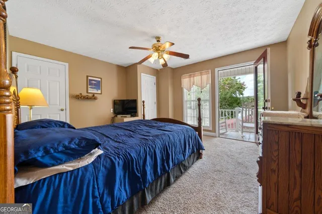 an aerial view of a houses with a lake view