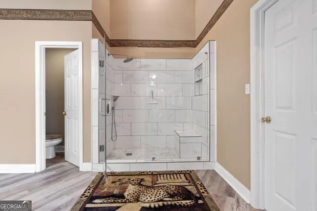 a bedroom with furniture and a fireplace