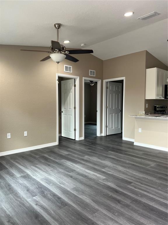 20855 Beach Boulevard Dunnellon, FL 34431 - Photo 6 of 14 a view of a hallway with wooden floor
