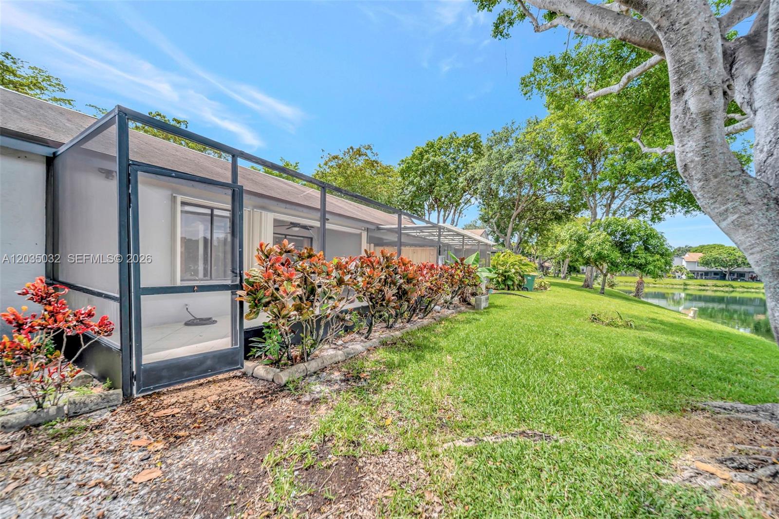 5223 Gate Lake Road, Unit 5223 Tamarac, FL 33319 - Photo 36 of 37 a view of a backyard with a garden
