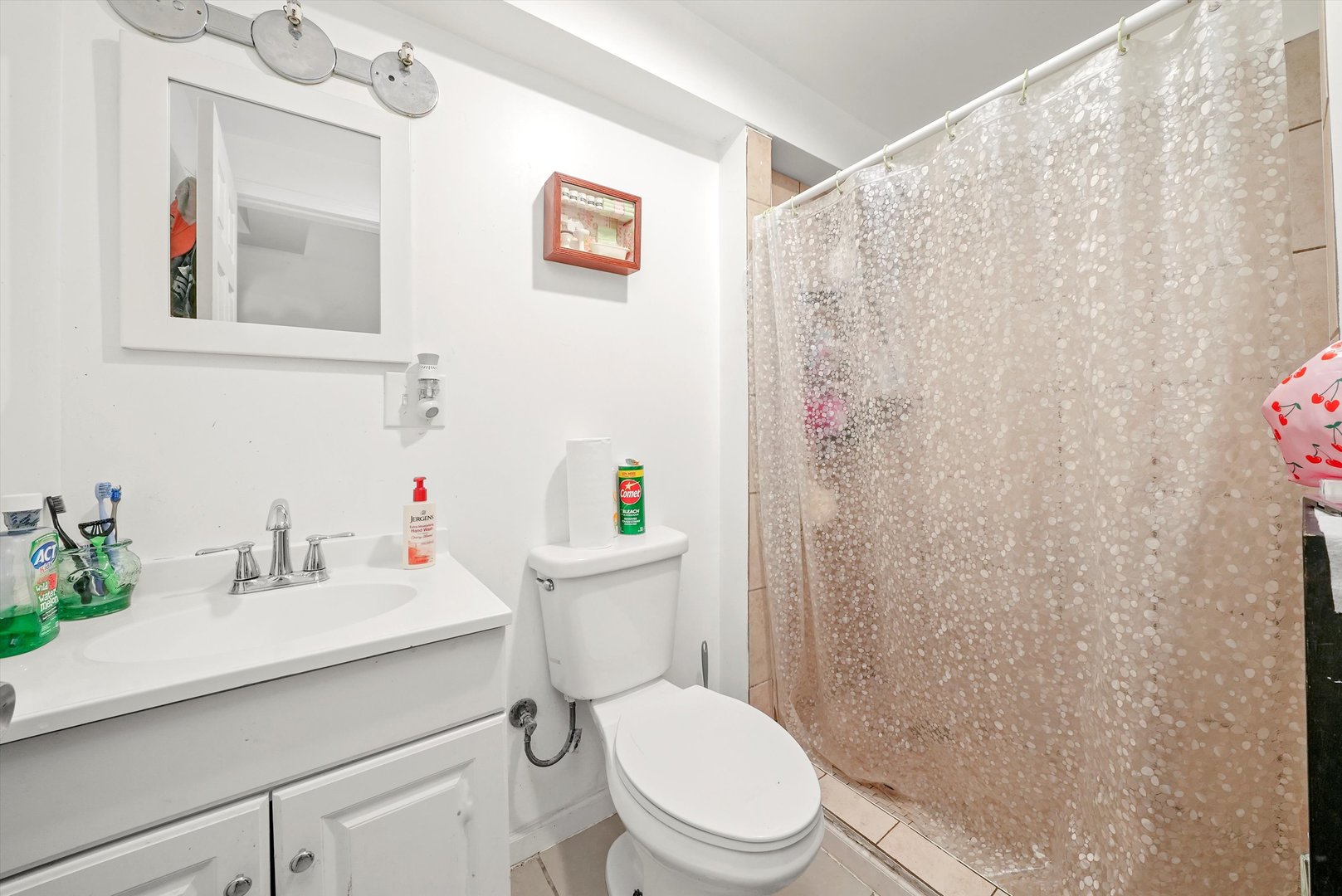 142 West Swann Street Chicago, IL 60609 - Photo 26 of 42 a white toilet sitting next to a bathroom sink