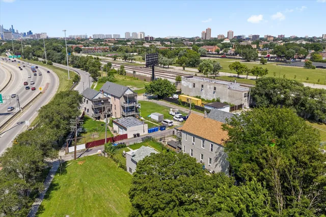 an aerial view of a house with yard swimming pool and outdoor seating