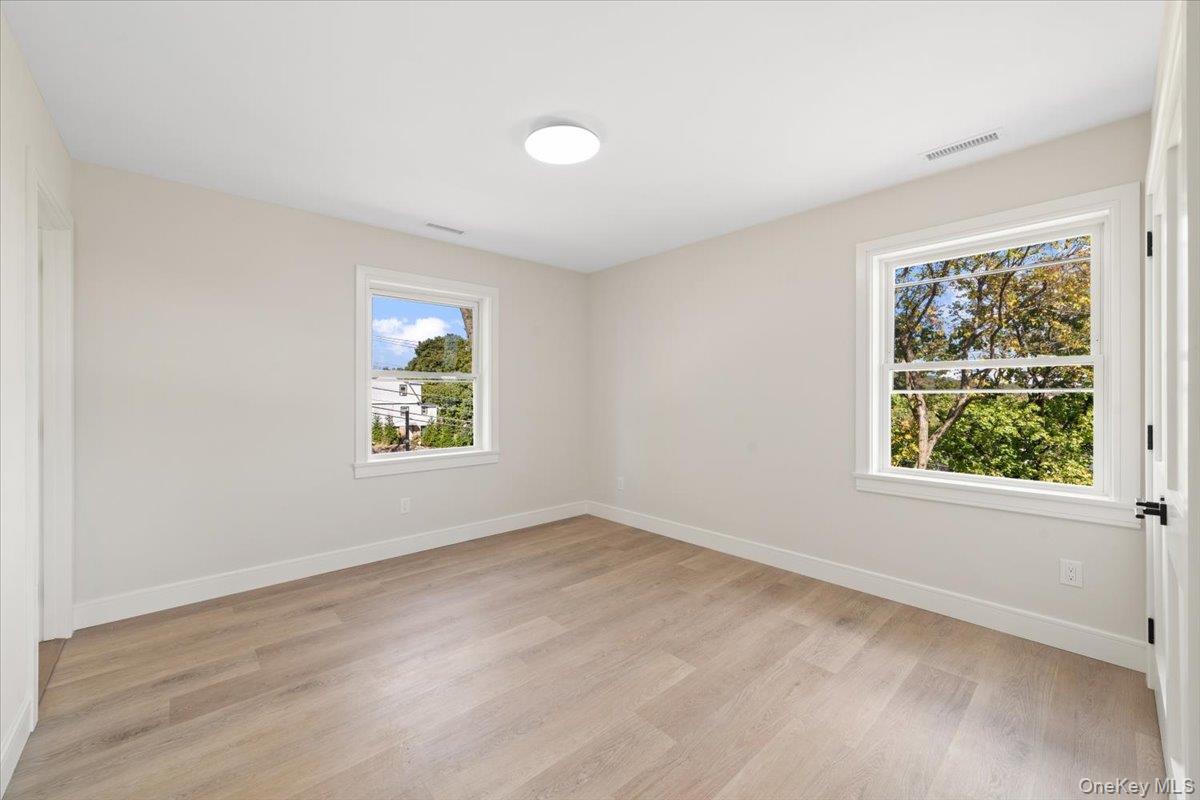 395 5th Avenue New Rochelle, NY 10801 - Photo 13 of 26 an empty room with windows