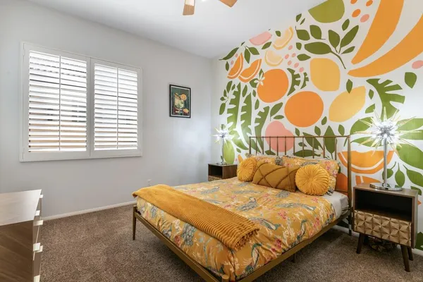 a bedroom with a bed and a window