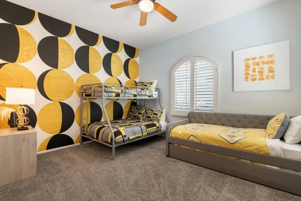 a bedroom with bed and a window