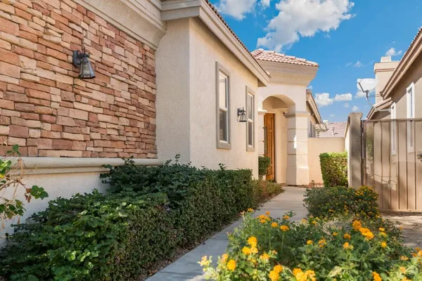 a front view of a house with garden