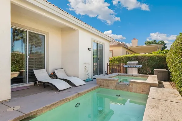 a patio with table and chairs