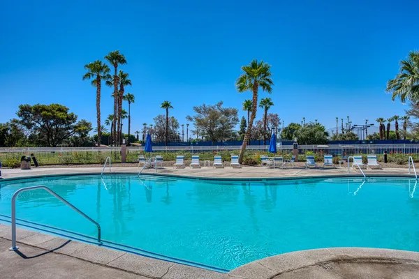 a view of a swimming pool and a fountain