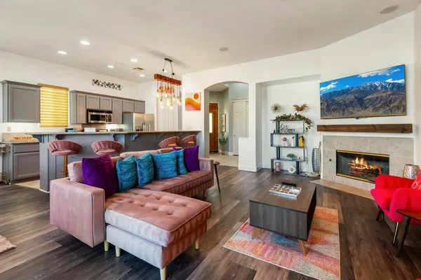 a living room with furniture fireplace and flat screen tv