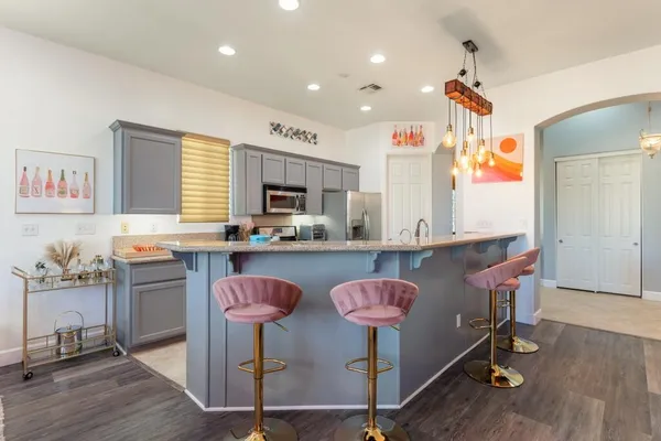 a kitchen with a sink cabinets and window