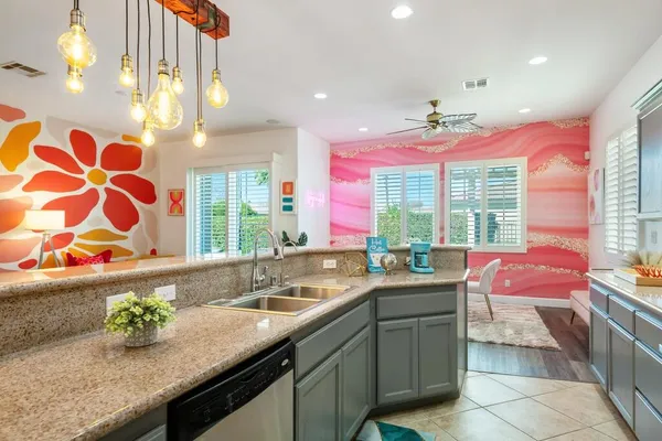 a kitchen with a sink stove and cabinets