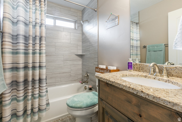 1228 North Providence Way Tooele, UT 84074 - Photo 17 of 28 Bathroom featuring a bathtub with tiled surround, a built-in shelf, and a transom window