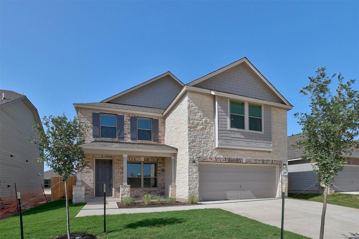 228 Skipping Stone Run Georgetown, TX 78628 - Photo 1 of 1 a front view of a house with a yard