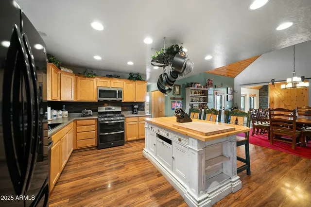 a living room with furniture and floor to ceiling windows