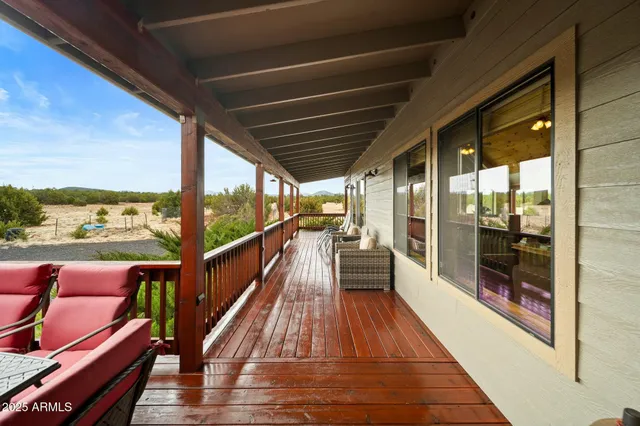 a view of balcony with wooden floor