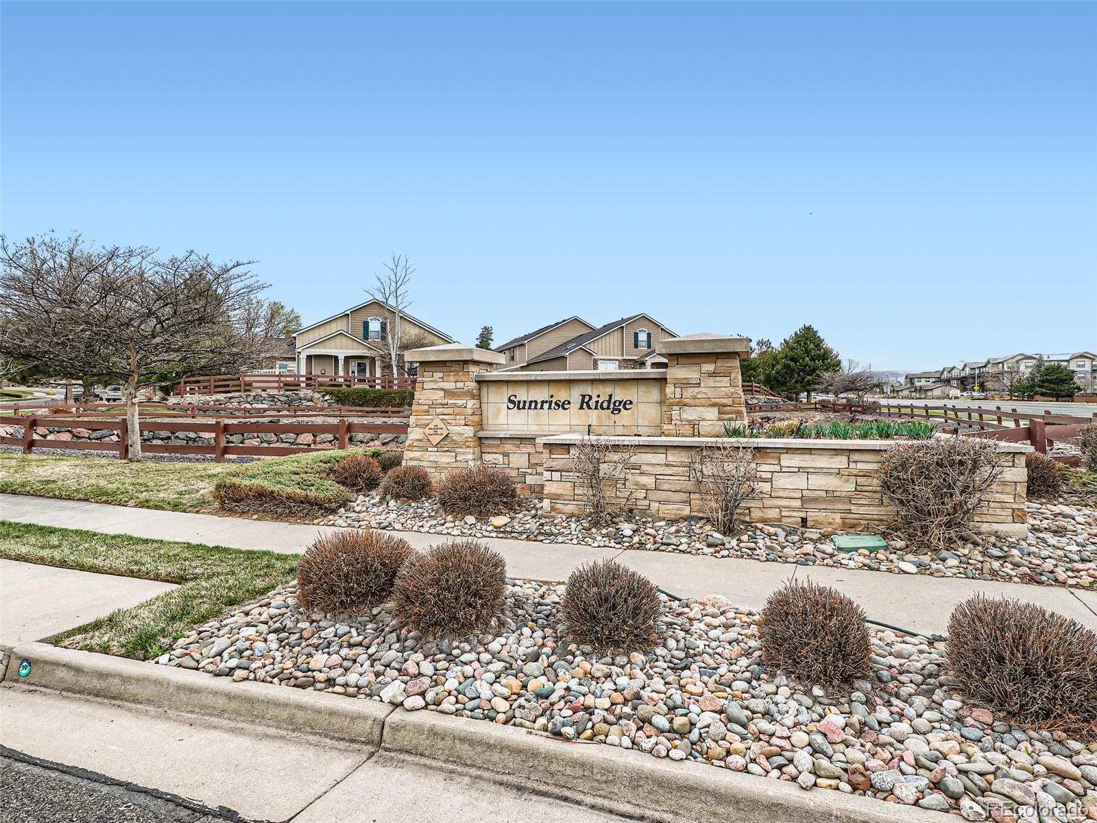 6224 Secrest Street Arvada, CO 80403 - Photo 11 of 16 a view of a lake with a houses