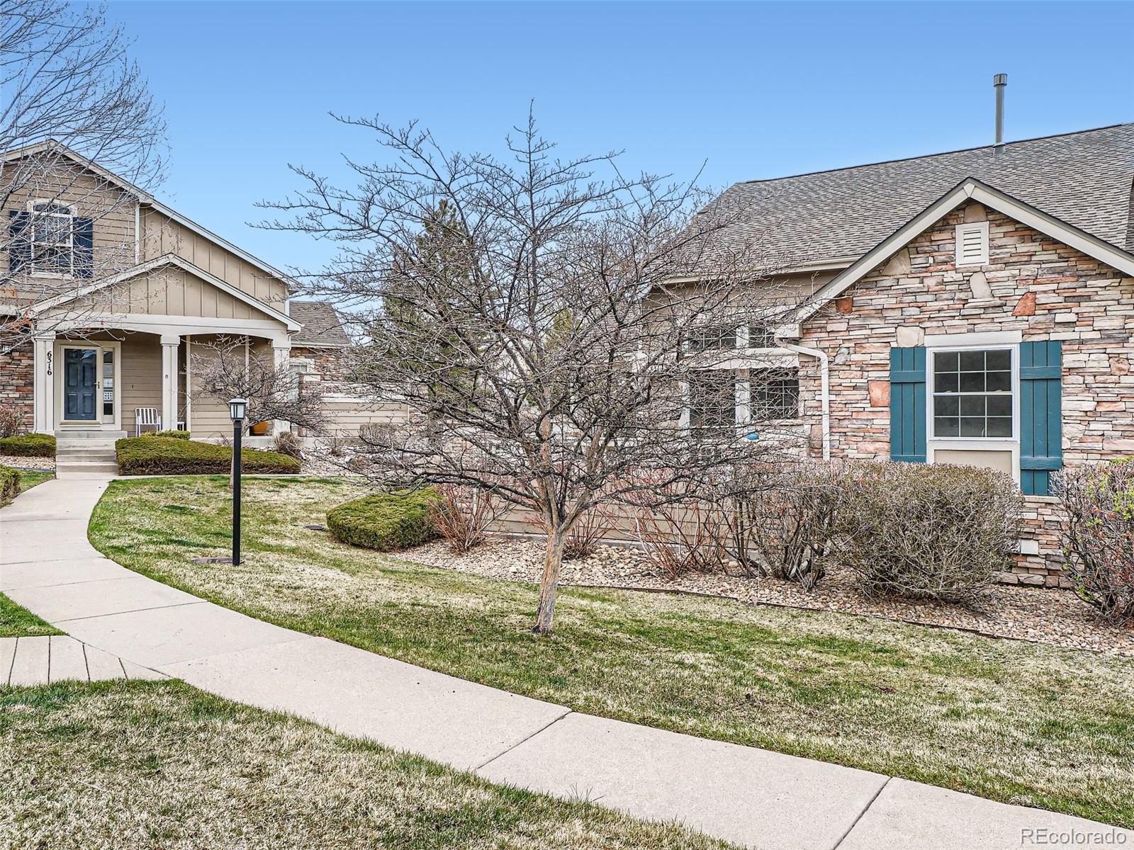 6224 Secrest Street Arvada, CO 80403 - Photo 16 of 16 a view of a house with a yard