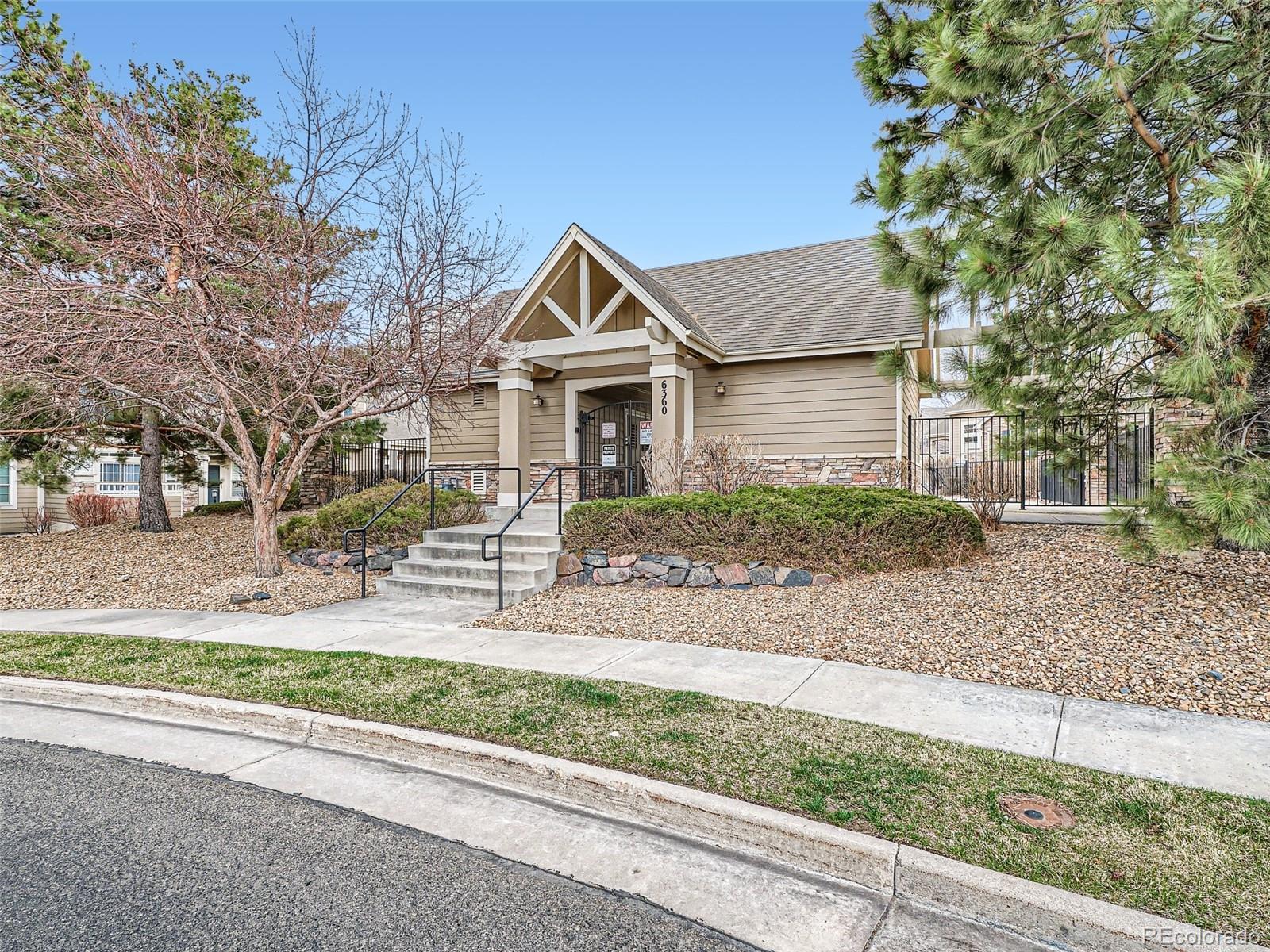 6224 Secrest Street Arvada, CO 80403 - Photo 9 of 16 front view of a house with a small yard