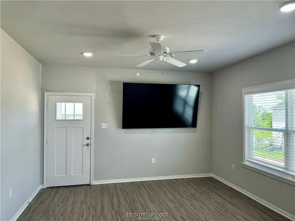 a kitchen with a sink and chandelier