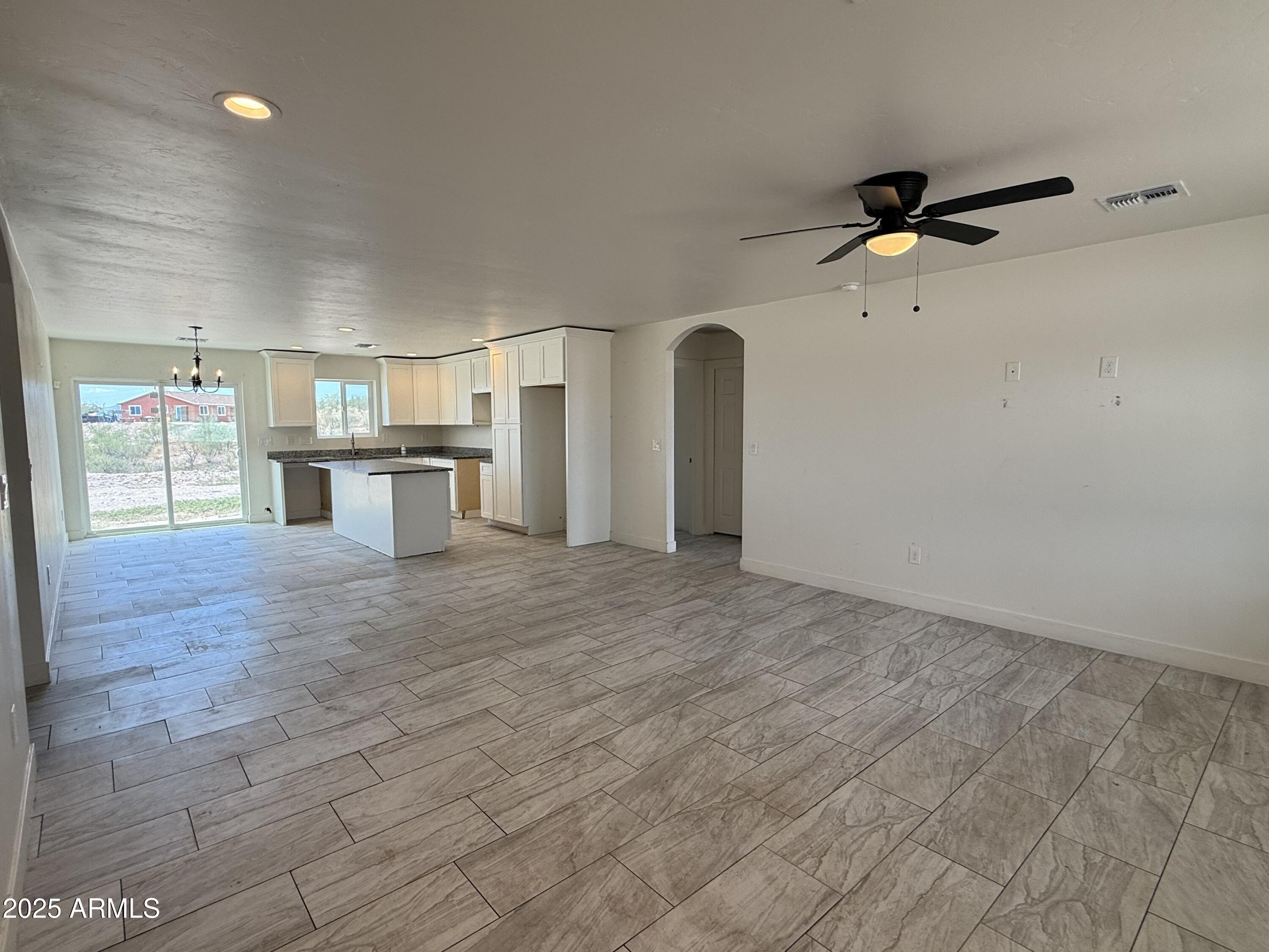 286 Guaymas Court Rio Rico, AZ 85648 - Photo 4 of 16 a view of a kitchen with furniture and a ceiling fan