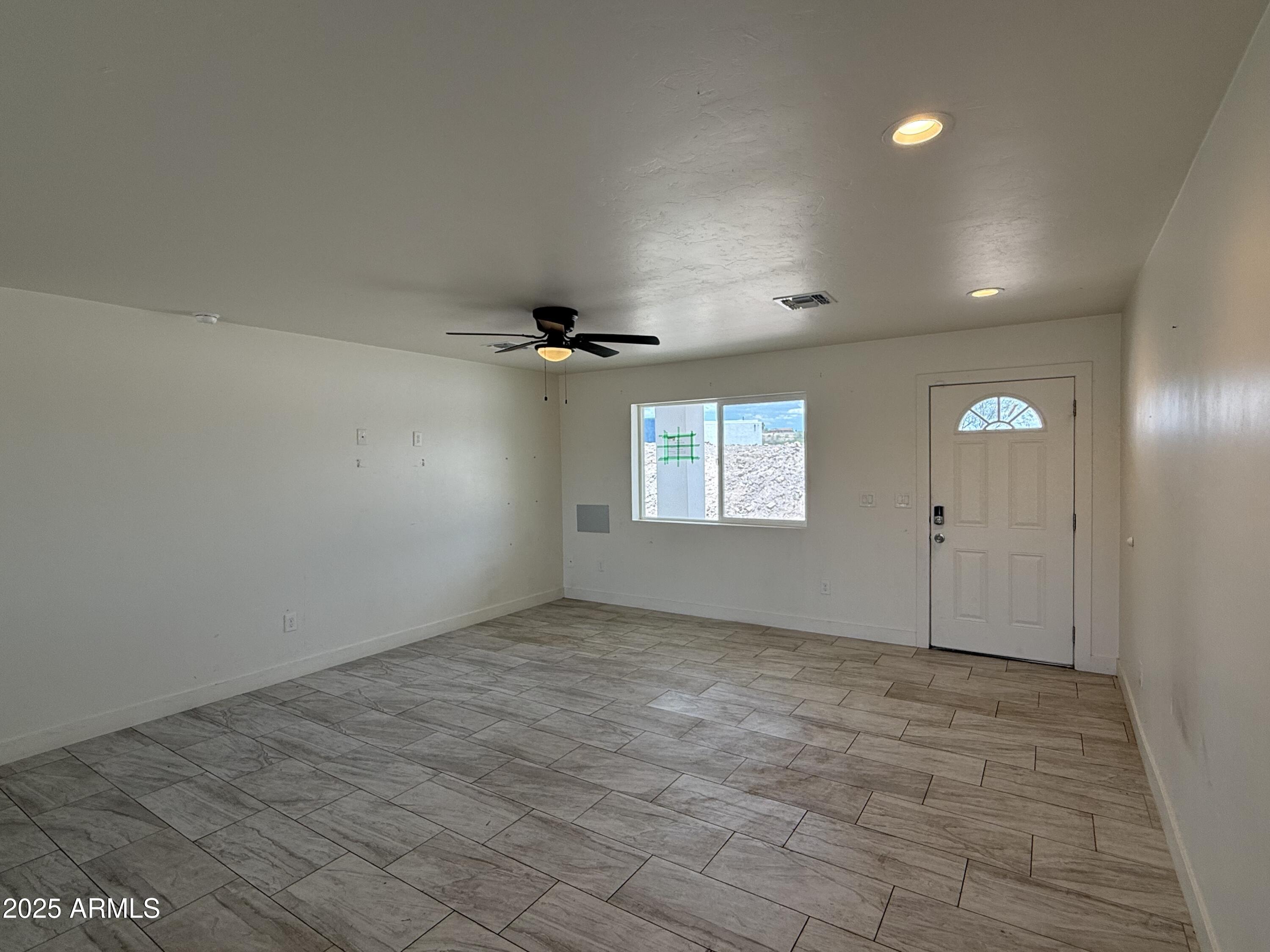 286 Guaymas Court Rio Rico, AZ 85648 - Photo 5 of 16 an empty room with windows and closet
