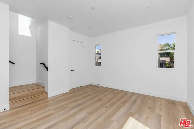 a bathroom with a shower a sink a toilet and mirror