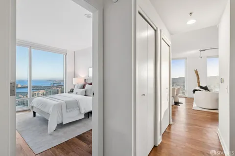 a spacious bedroom with a bed and a couch