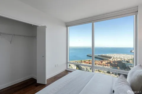 a view of a living room and floor to ceiling window
