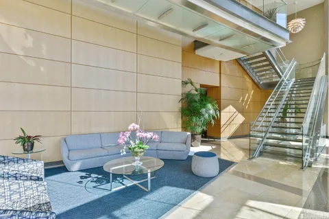 a living room with furniture and flowers