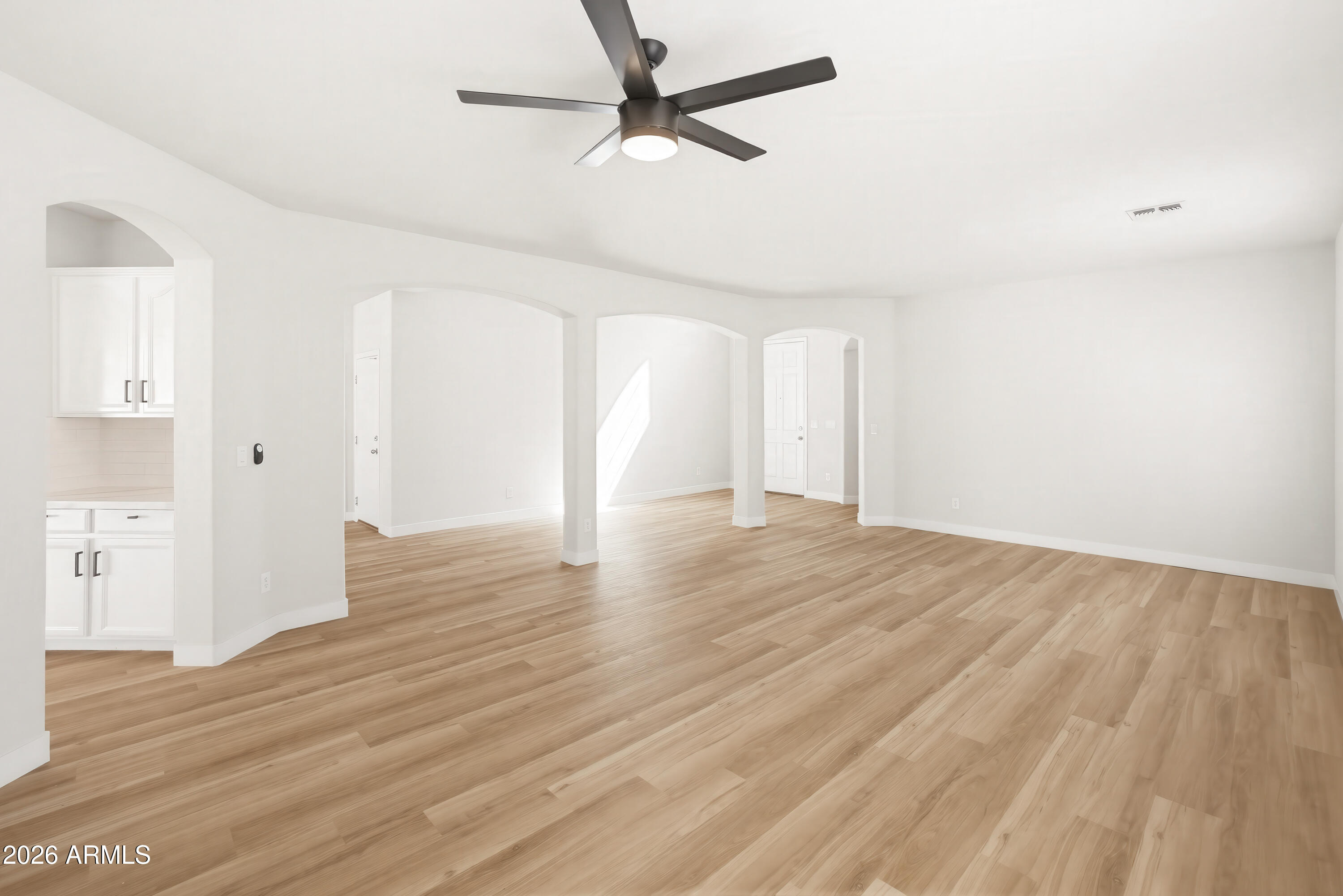 17328 West Bajada Road Surprise, AZ 85387 - Photo 12 of 40 a view of an empty room with wooden floor