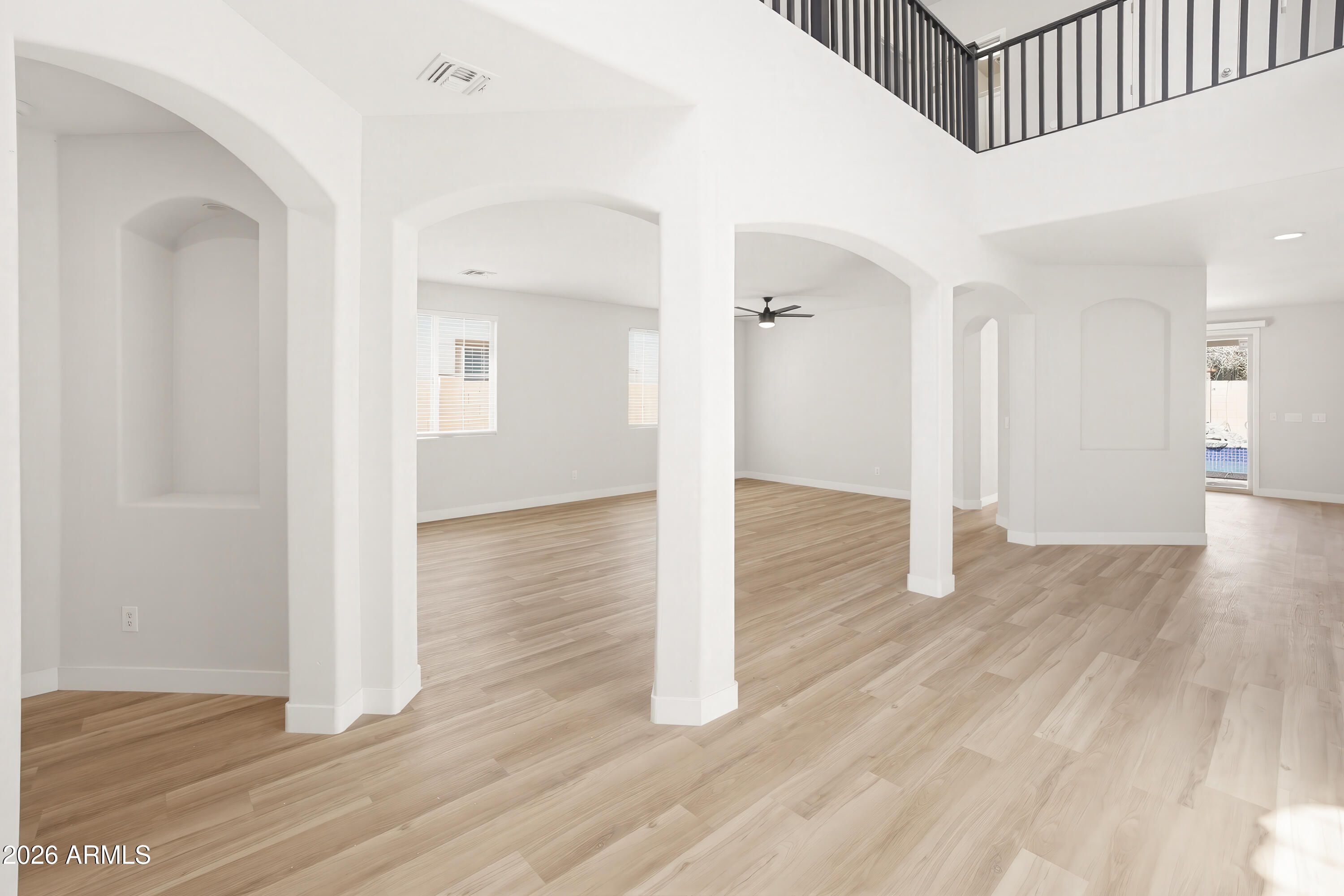 17328 West Bajada Road Surprise, AZ 85387 - Photo 14 of 40 a view of a hallway with wooden floor