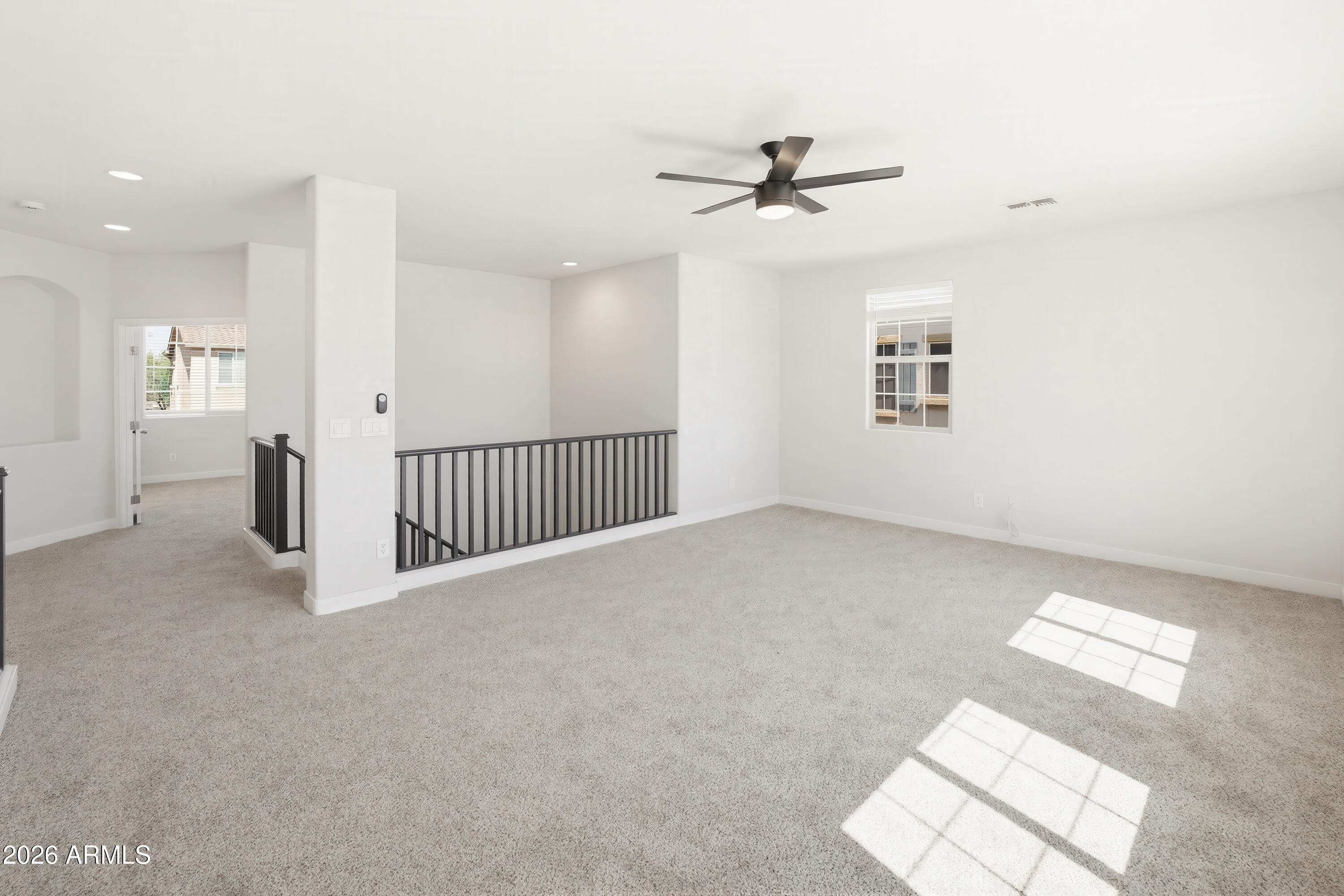 17328 West Bajada Road Surprise, AZ 85387 - Photo 18 of 40 a view of a livingroom with a ceiling fan and window