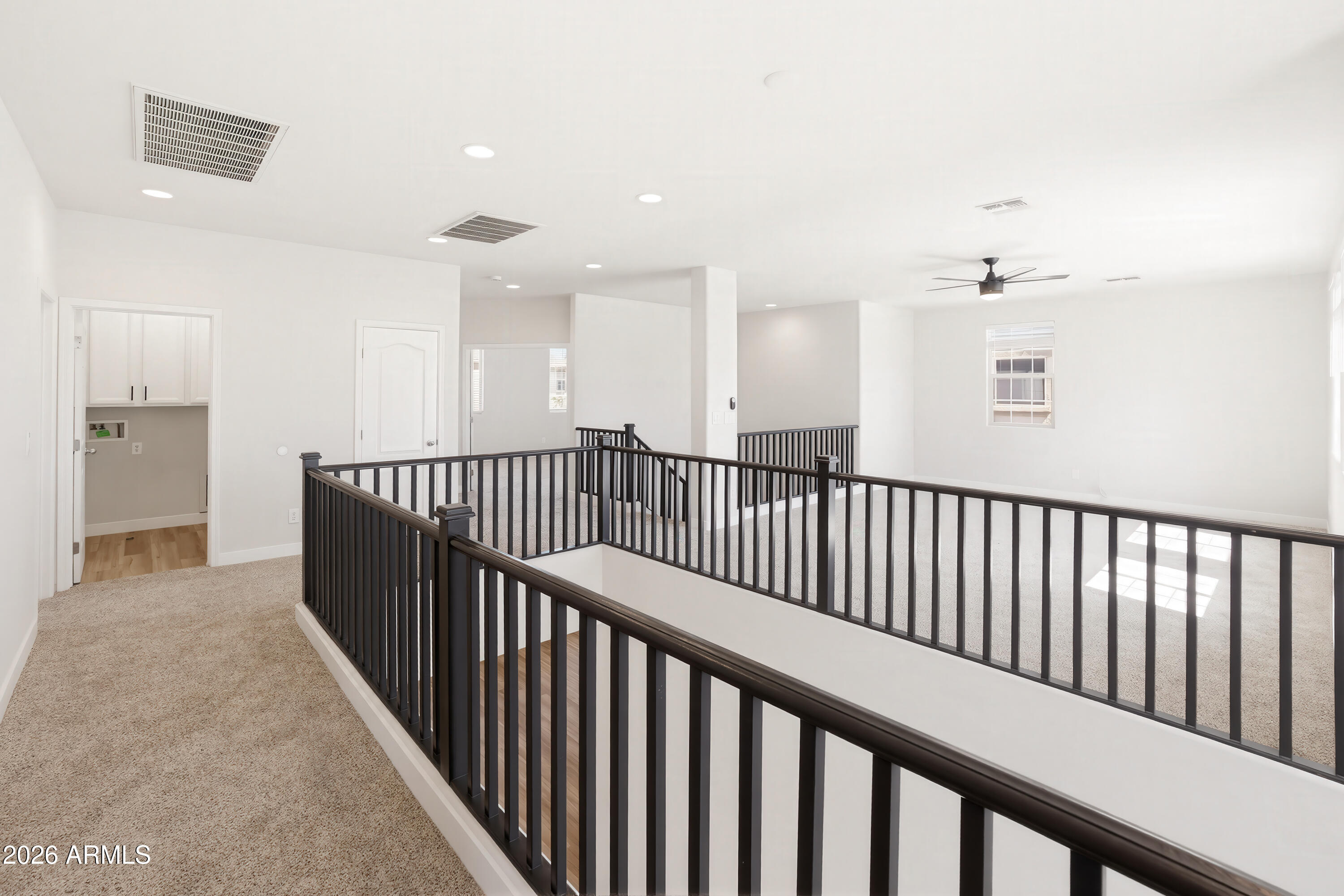 17328 West Bajada Road Surprise, AZ 85387 - Photo 19 of 40 a view of a hallway with wooden floor