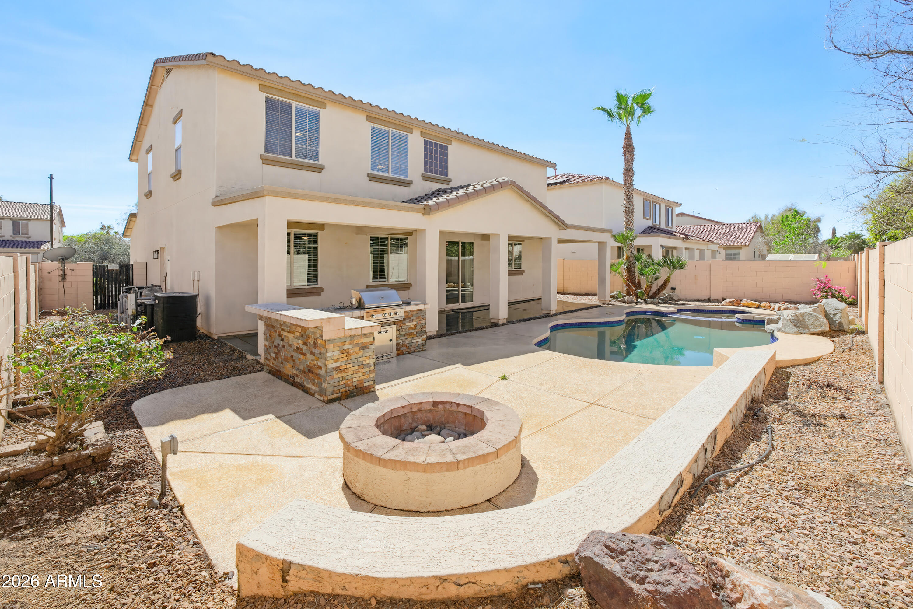 17328 West Bajada Road Surprise, AZ 85387 - Photo 2 of 40 a front view of a house with porch garden and outdoor seating