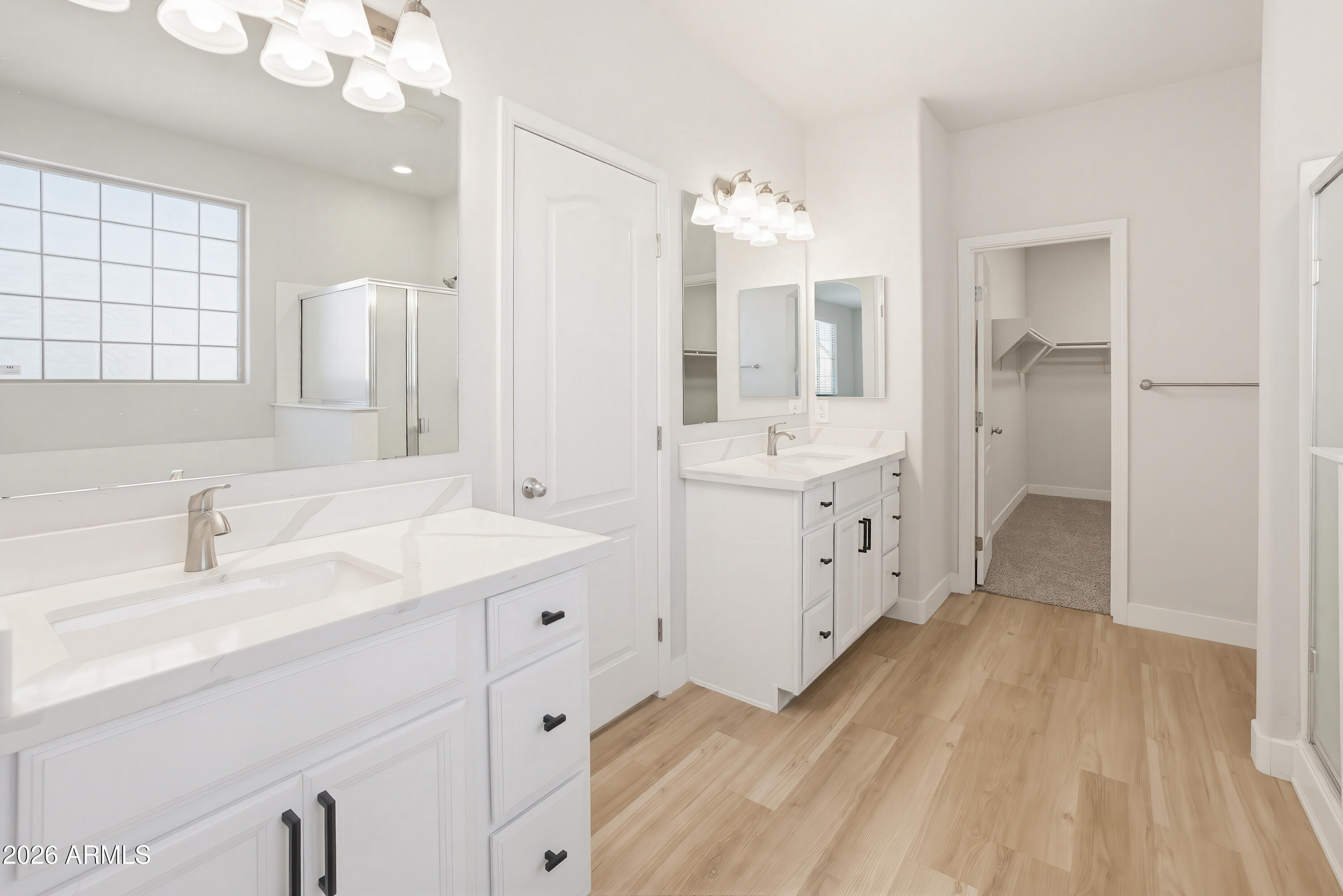 17328 West Bajada Road Surprise, AZ 85387 - Photo 23 of 40 a spacious bathroom with a double vanity sink mirror and