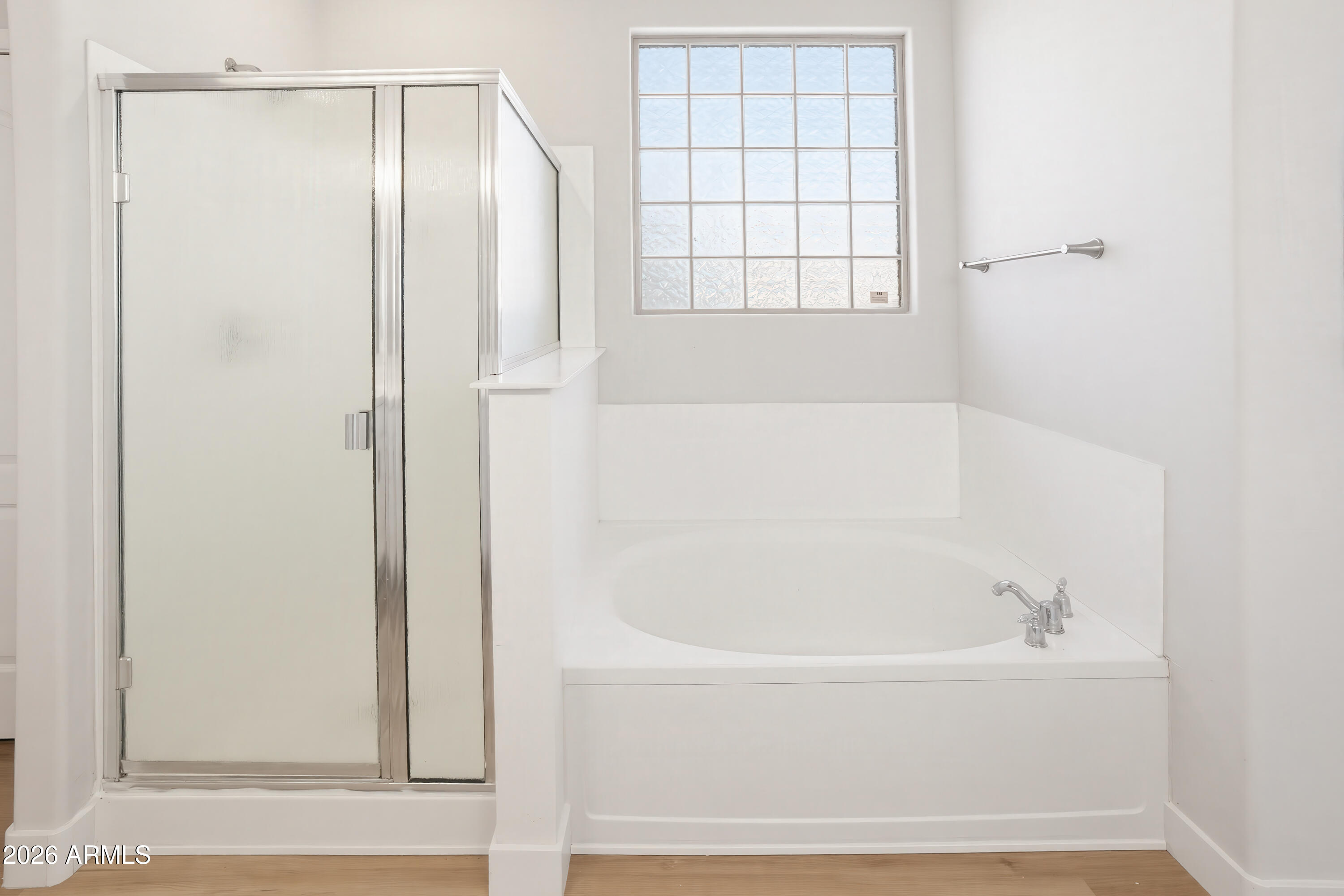 17328 West Bajada Road Surprise, AZ 85387 - Photo 24 of 40 a white bath tub sitting next to a window